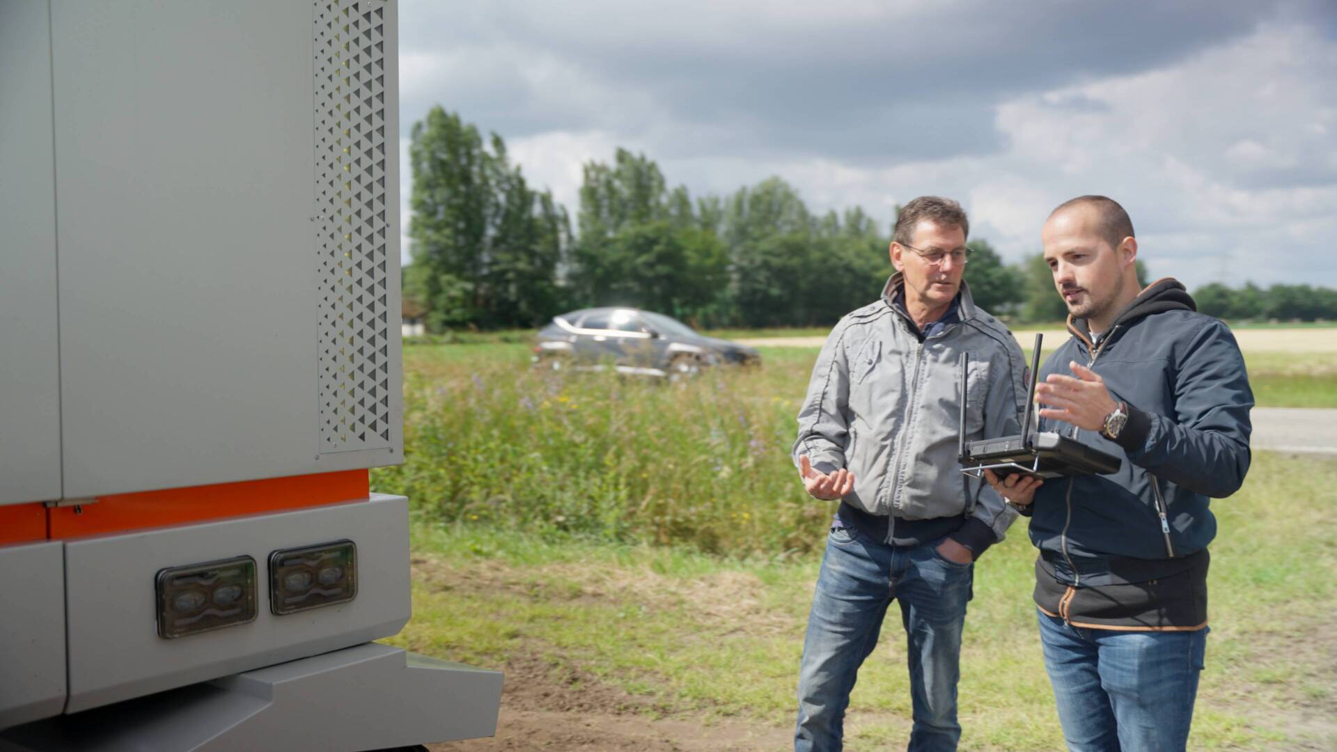 Operator explaining controls to grower during onboarding program for Robot One