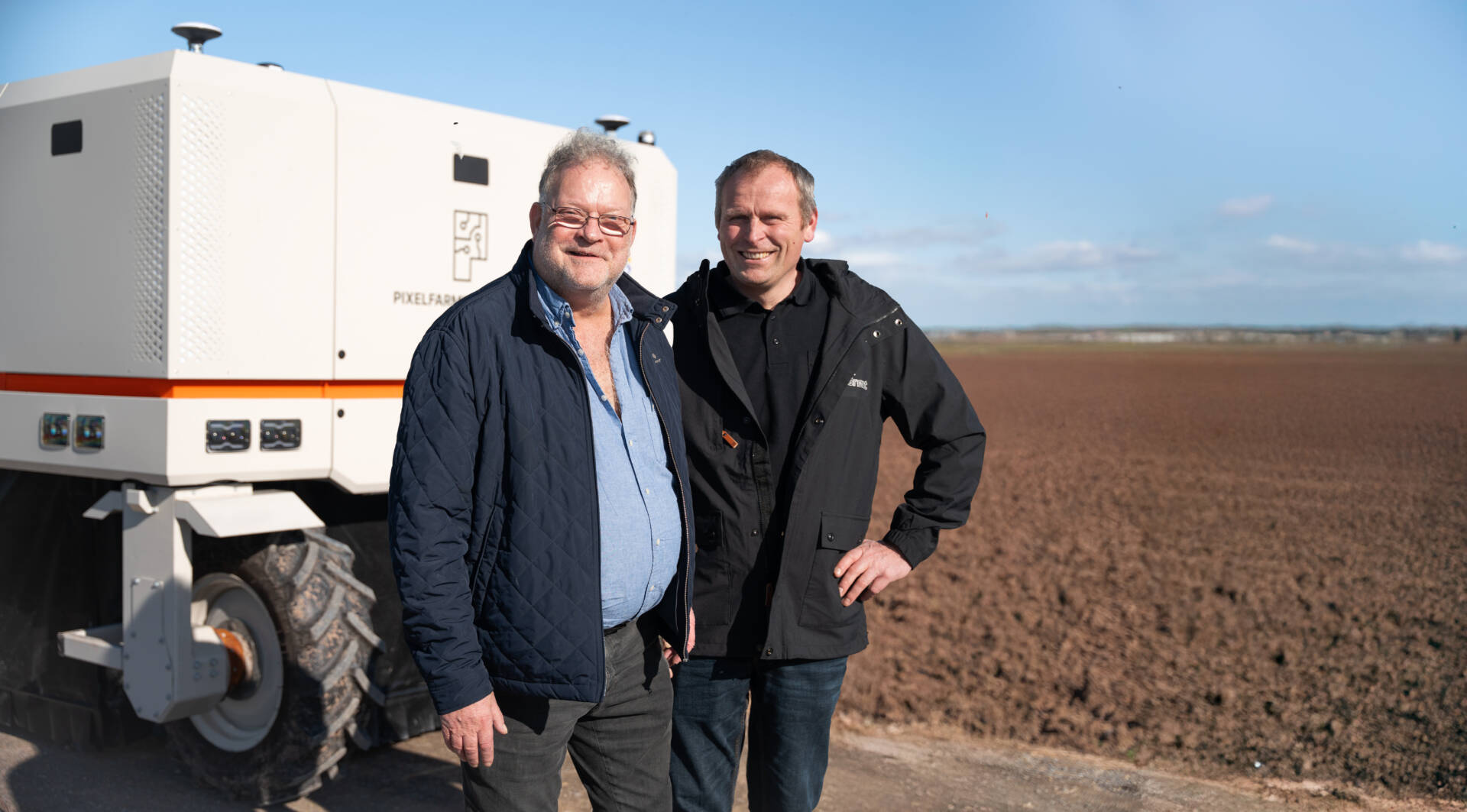 Per Hardenberg and Rasmus Birk proudly standing next to Robot One