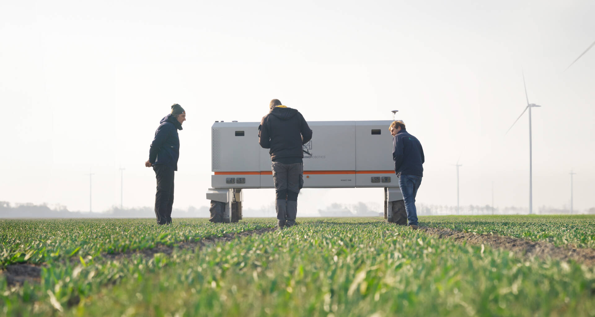 Growers being trained how to use Robot One in onboarding program